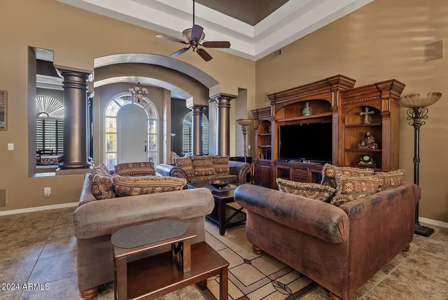 a bedroom with two beds and a table