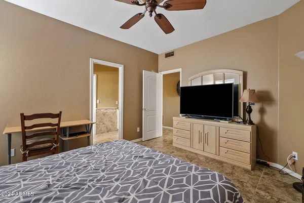 a view of a swimming pool with sitting area