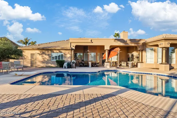 a house with palm trees in front of it