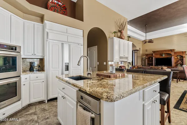 a living room with furniture fireplace and a flat screen tv