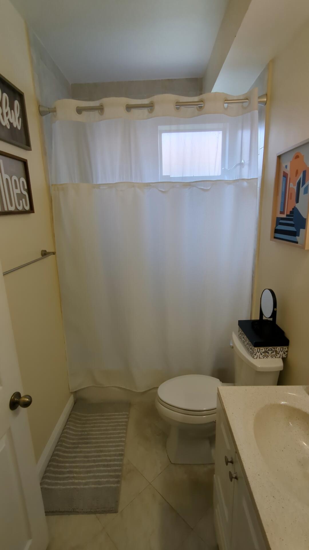 1481 Southwest 105th Avenue Pembroke Pines, FL 33025 - Photo 8 of 9 a bathroom with a sink a toilet and a tub