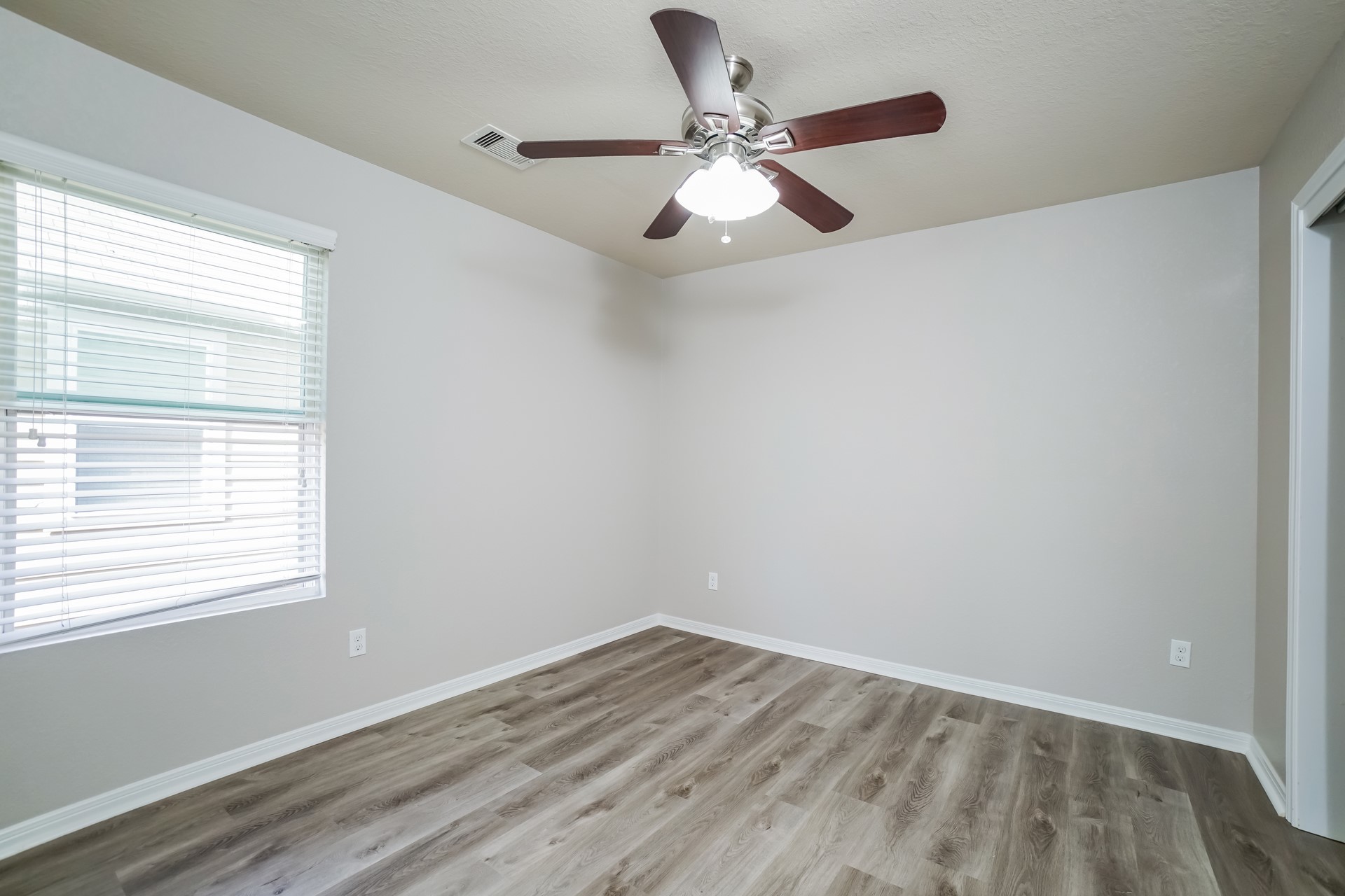 2694 Elm Crossing Trail Spring, TX 77386 - Photo 15 of 17 wooden floor in an empty room with a window