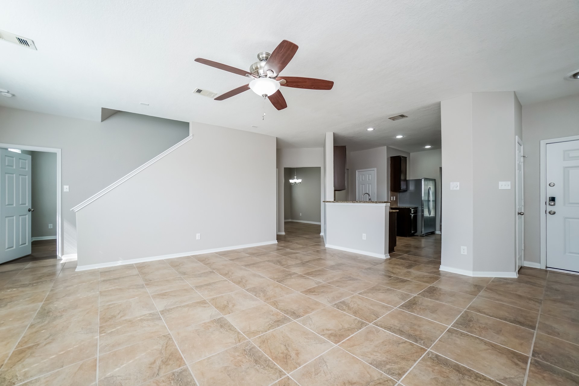 2694 Elm Crossing Trail Spring, TX 77386 - Photo 5 of 17 a view of a kitchen with a sink and a cabinet a microwave