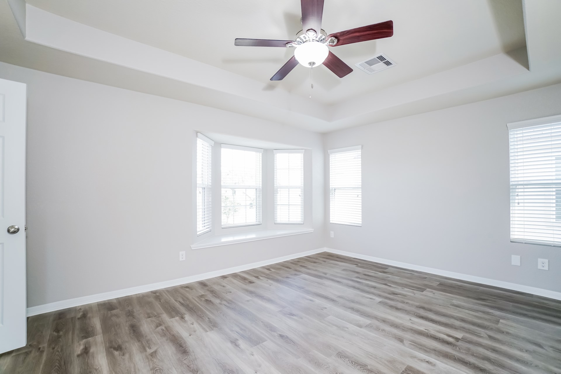 2694 Elm Crossing Trail Spring, TX 77386 - Photo 10 of 17 wooden floor in an empty room with a window
