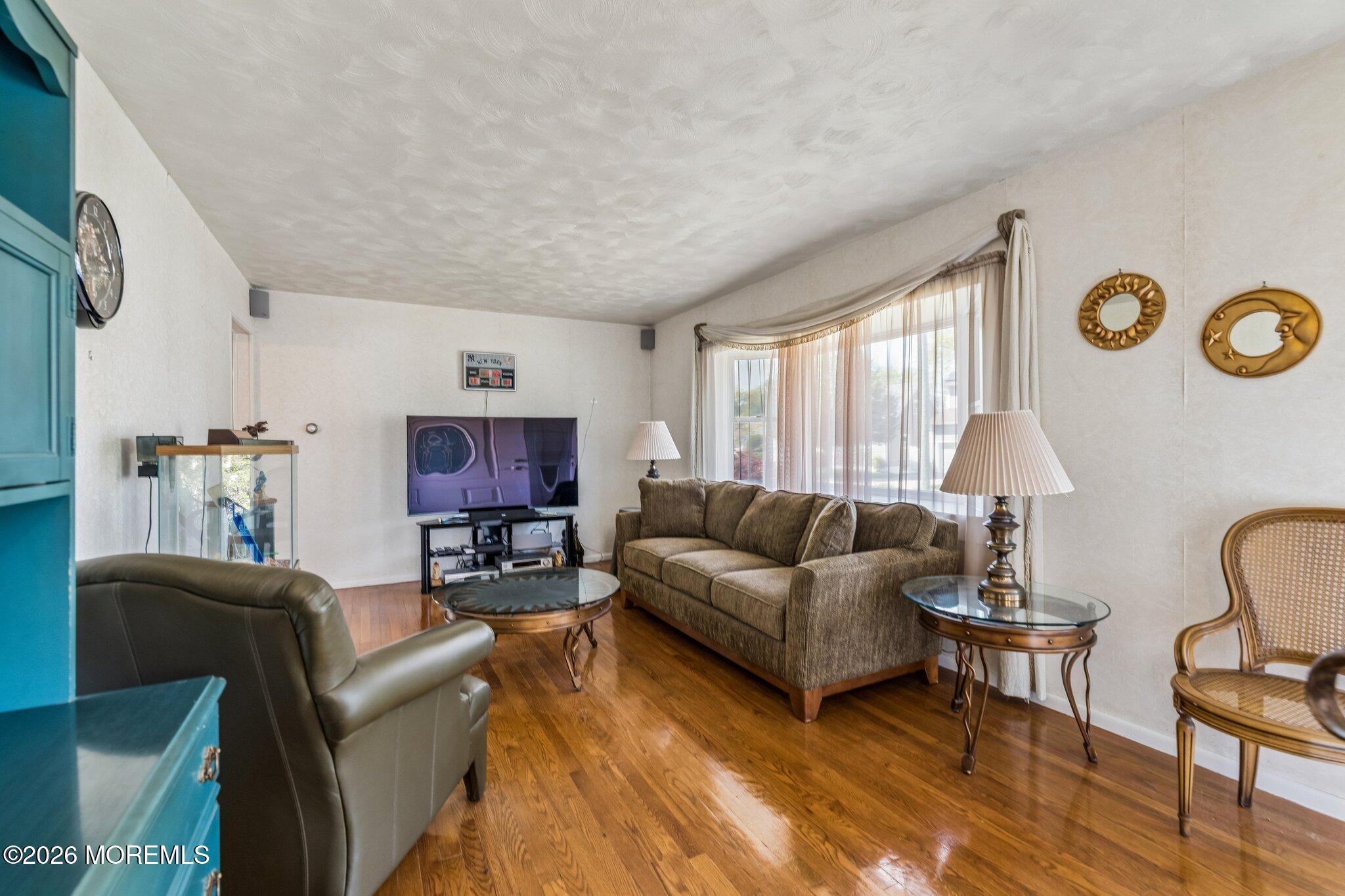 624 North Manetta Drive Point Pleasant, NJ 08742 - Photo 16 of 27 a living room with furniture a rug and a window