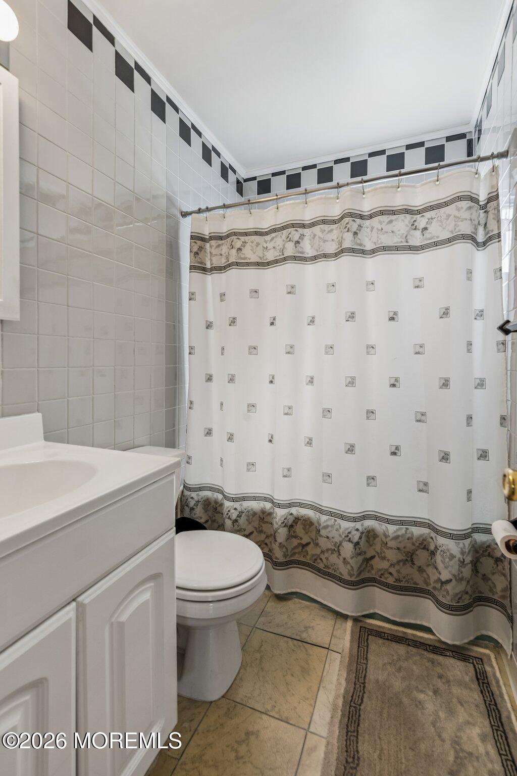 624 North Manetta Drive Point Pleasant, NJ 08742 - Photo 22 of 27 a bathroom with a granite countertop sink and a toilet