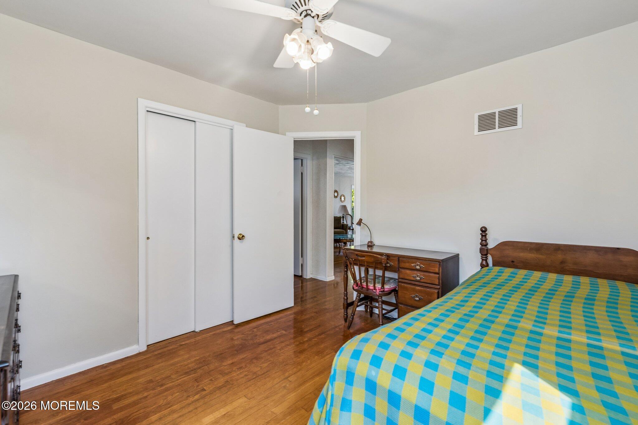 624 North Manetta Drive Point Pleasant, NJ 08742 - Photo 24 of 27 a bedroom with a bed and a dresser in it