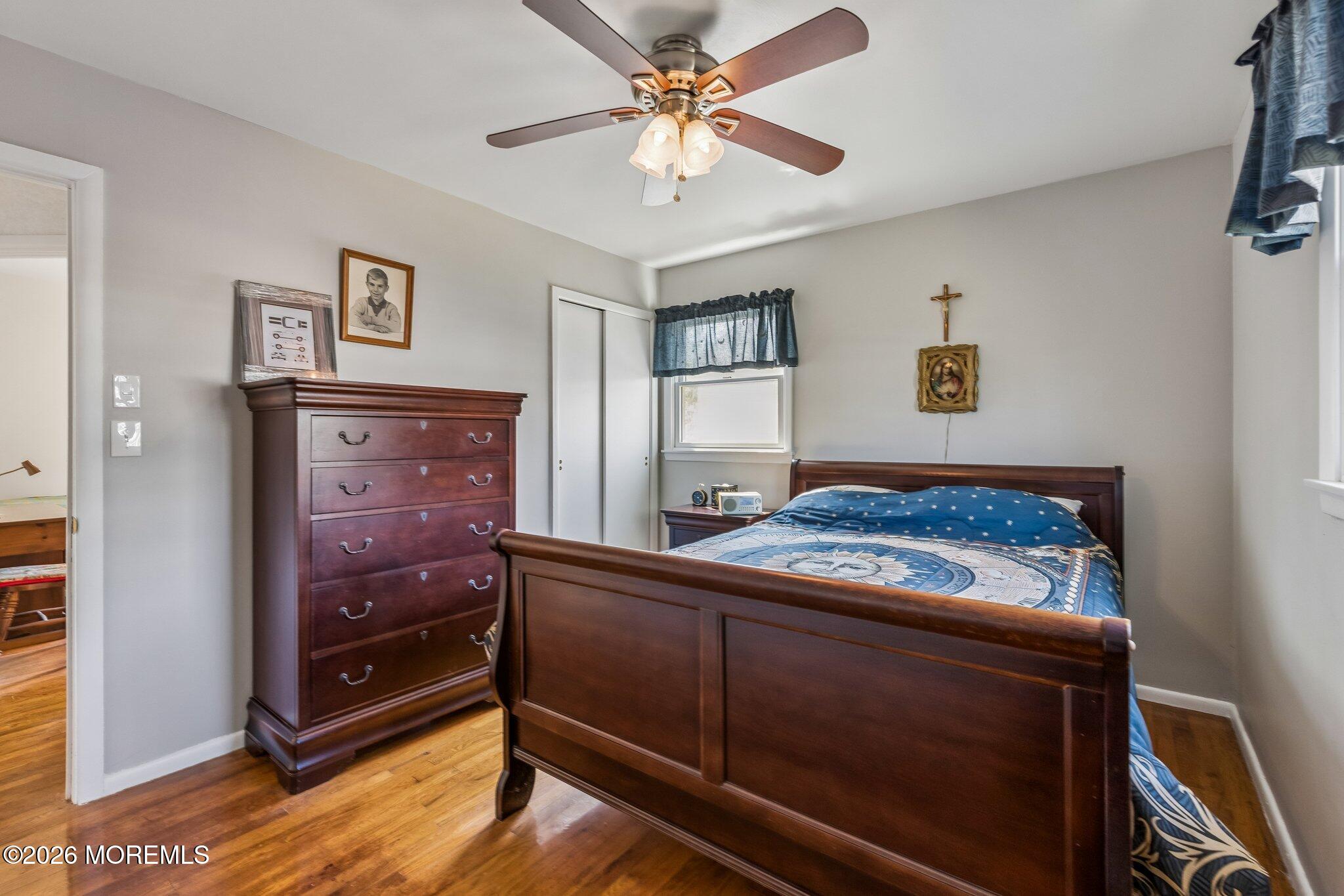 624 North Manetta Drive Point Pleasant, NJ 08742 - Photo 26 of 27 a living room with hard wood floors and a ceiling fan