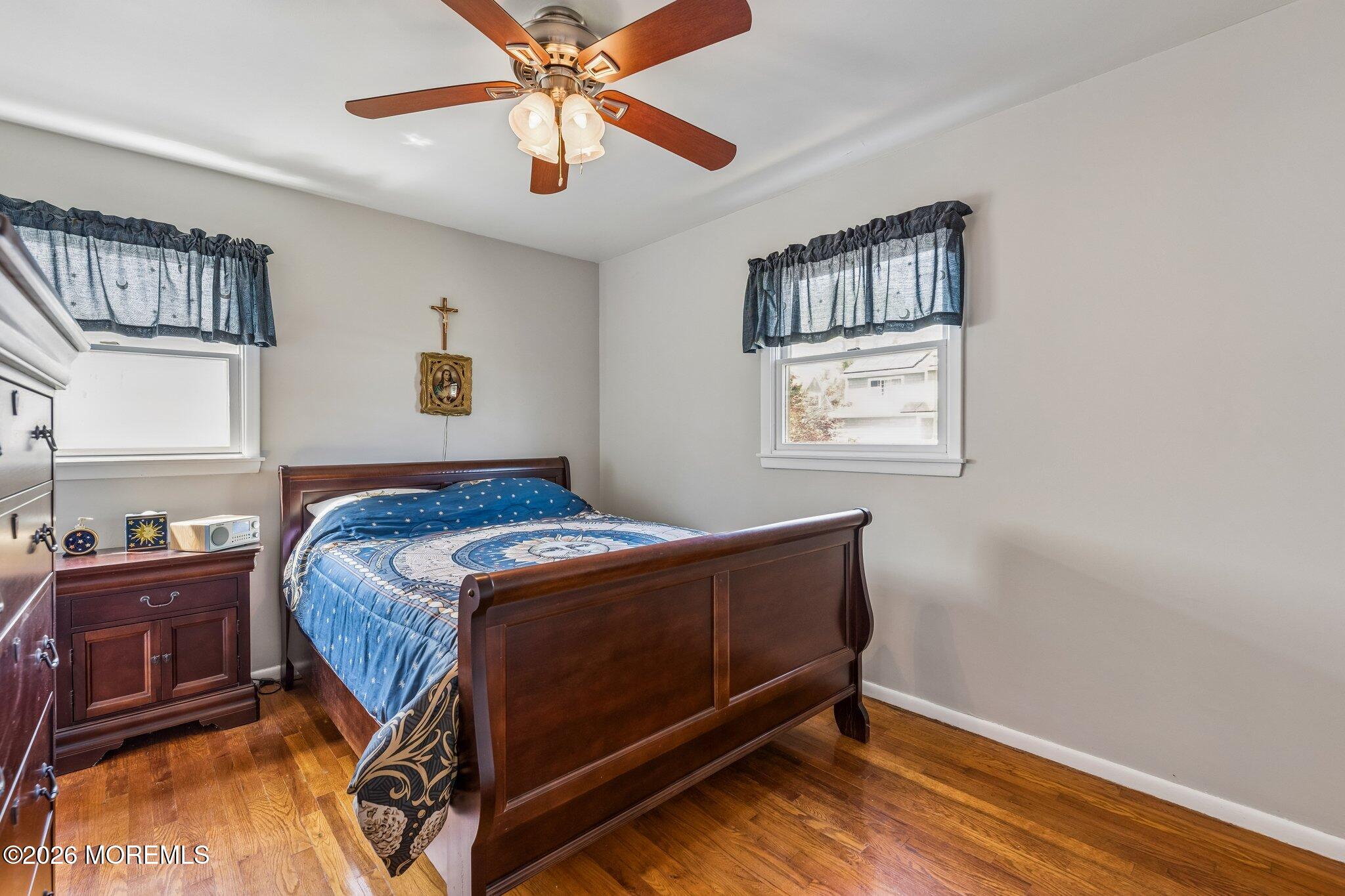 624 North Manetta Drive Point Pleasant, NJ 08742 - Photo 27 of 27 a bedroom with a bed and cabinet