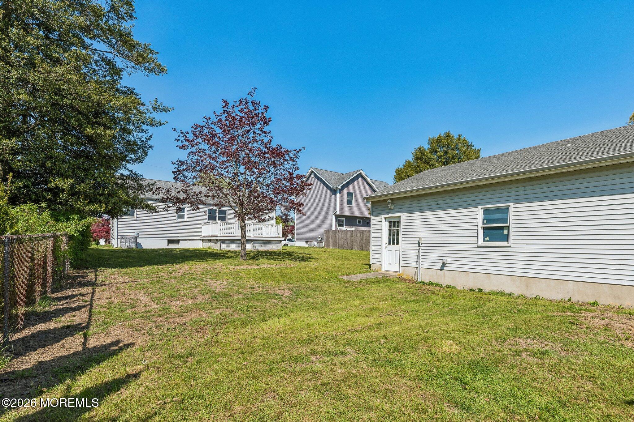 624 North Manetta Drive Point Pleasant, NJ 08742 - Photo 5 of 27 a backyard of a house with large trees