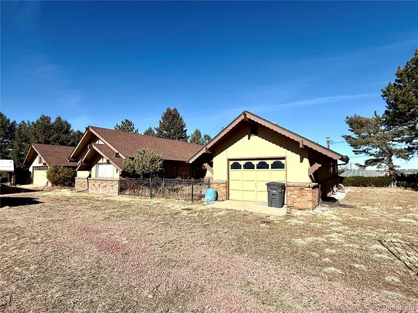 a view of outdoor space and front view of a house