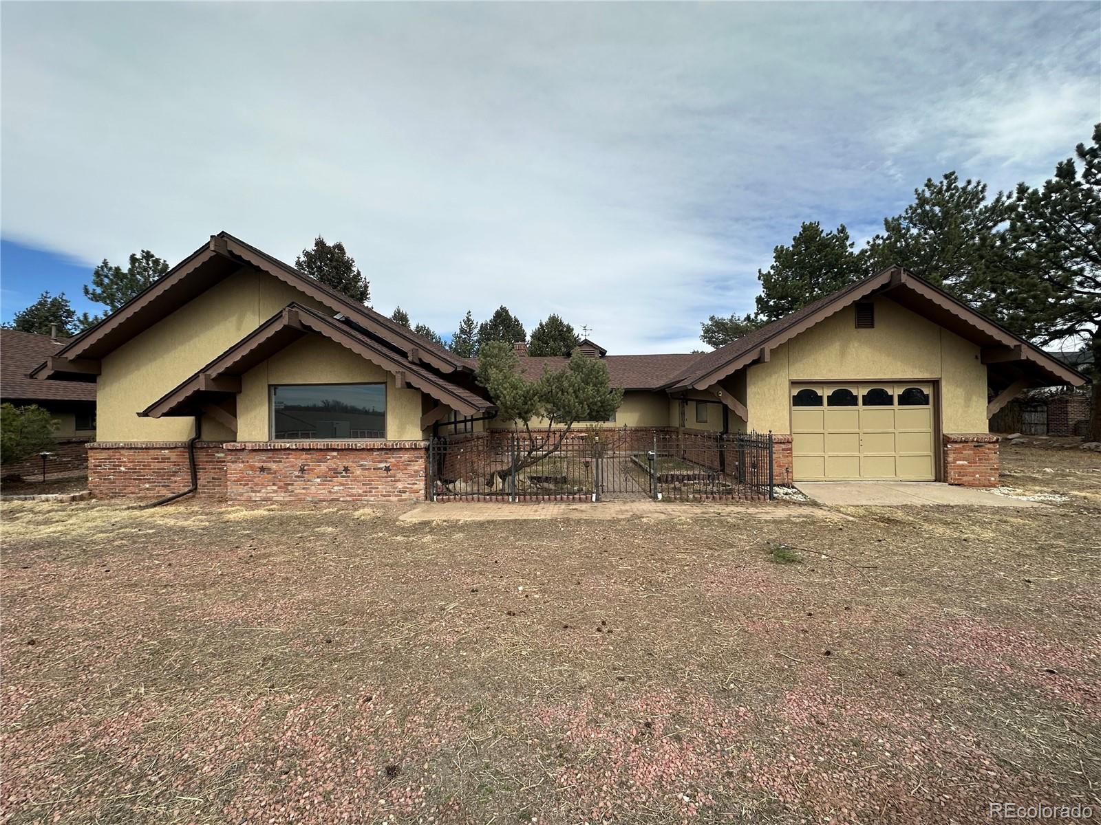 6105 West 49th Place Wheat Ridge, CO 80033 - Photo 21 of 40 a view of a house with a yard