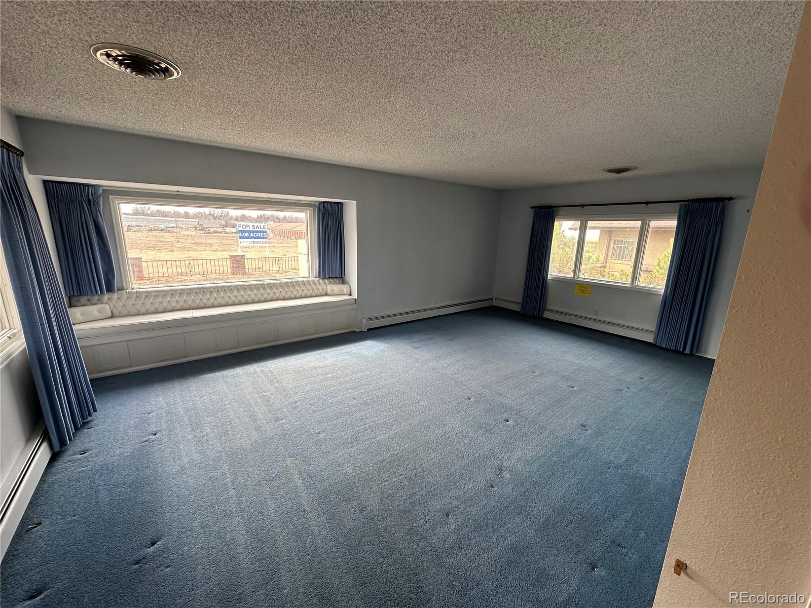 6105 West 49th Place Wheat Ridge, CO 80033 - Photo 23 of 40 an empty room with a window