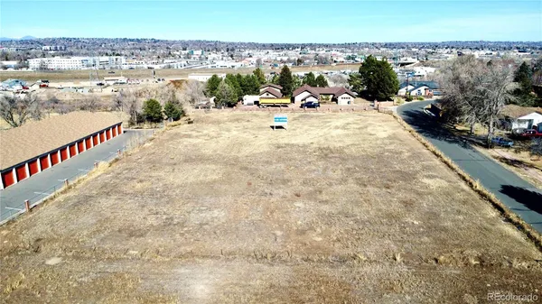 an aerial view of multiple houses with outdoor space