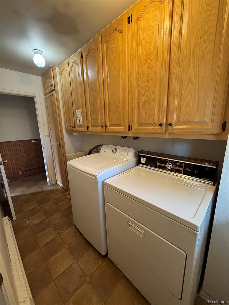 6105 West 49th Place Wheat Ridge, CO 80033 - Photo 34 of 40 a utility room with dryer and washer