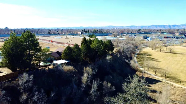 an aerial view of a house with swimming pool and sitting space