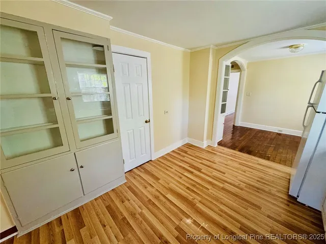 a bedroom with a bed and a mirror