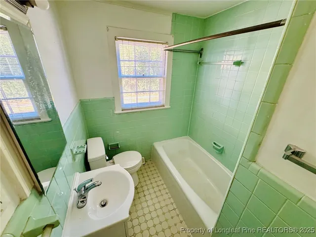 a bathroom with sink and a mirror