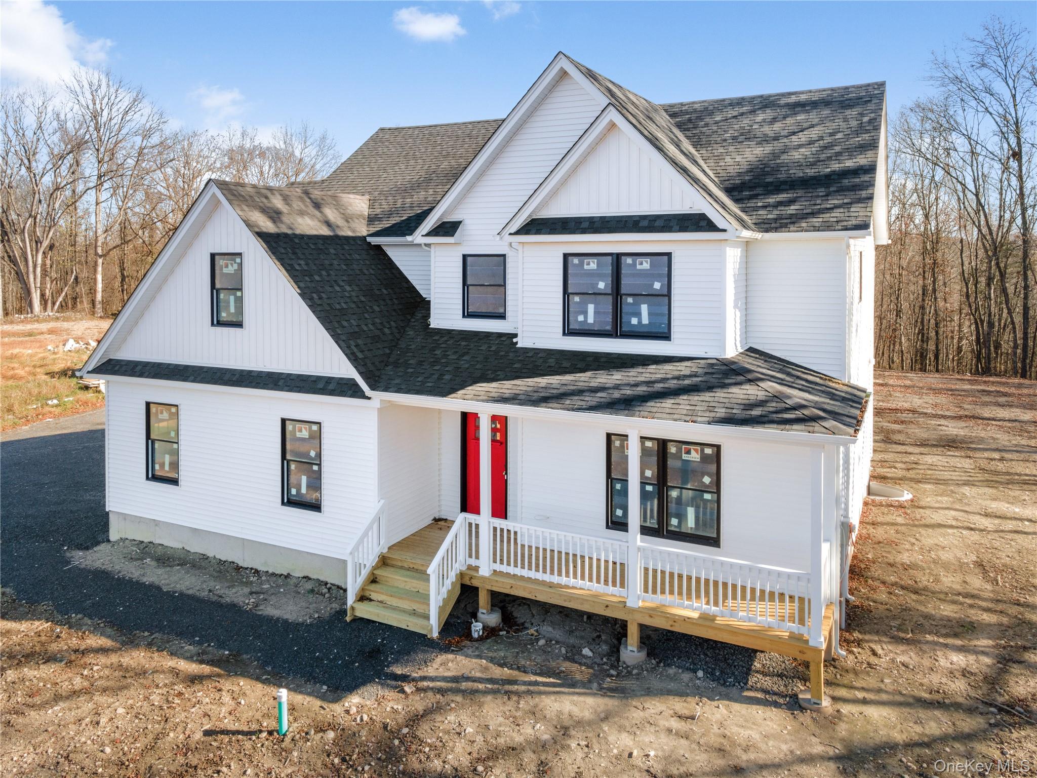 13 Harrier Ridge Drive Wallkill, NY 12589 - Photo 1 of 40 Modern farmhouse featuring a shingled roof and covered porch