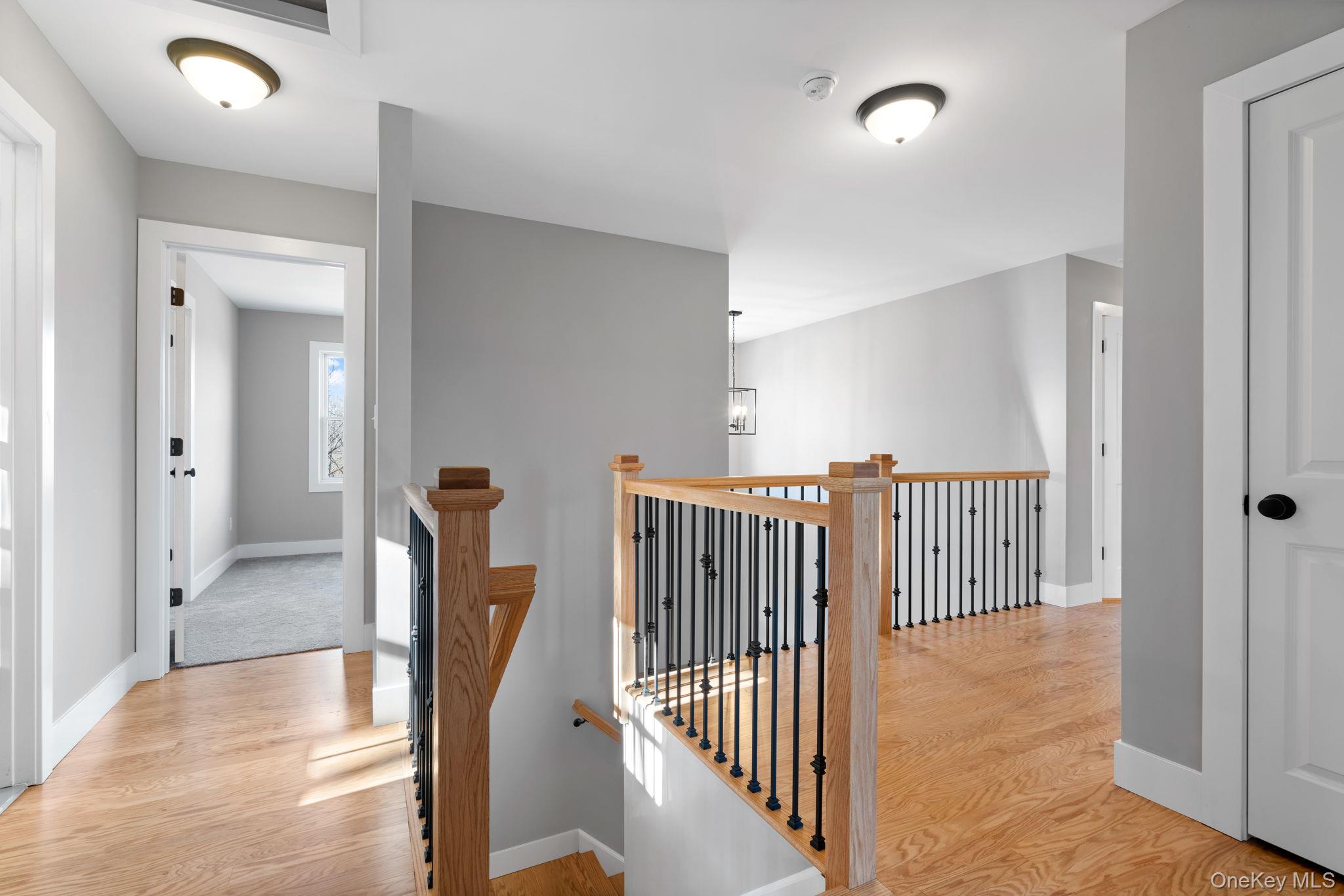 13 Harrier Ridge Drive Wallkill, NY 12589 - Photo 17 of 40 Hall featuring an upstairs landing and light wood-style flooring