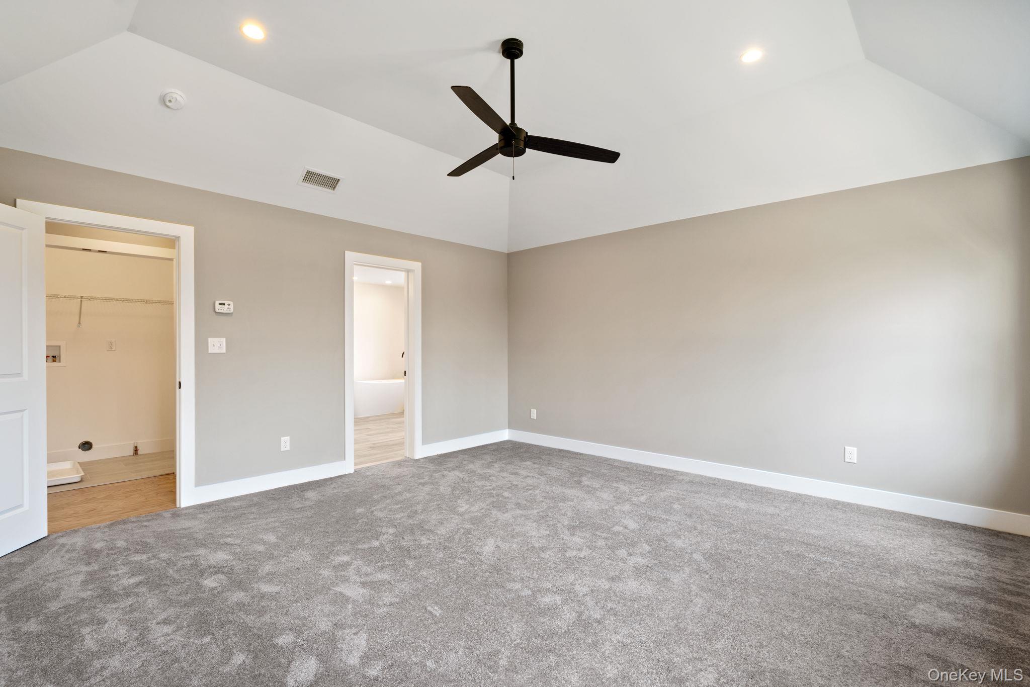 13 Harrier Ridge Drive Wallkill, NY 12589 - Photo 20 of 40 Unfurnished bedroom featuring lofted ceiling, ensuite bath, light colored carpet, ceiling fan, and recessed lighting