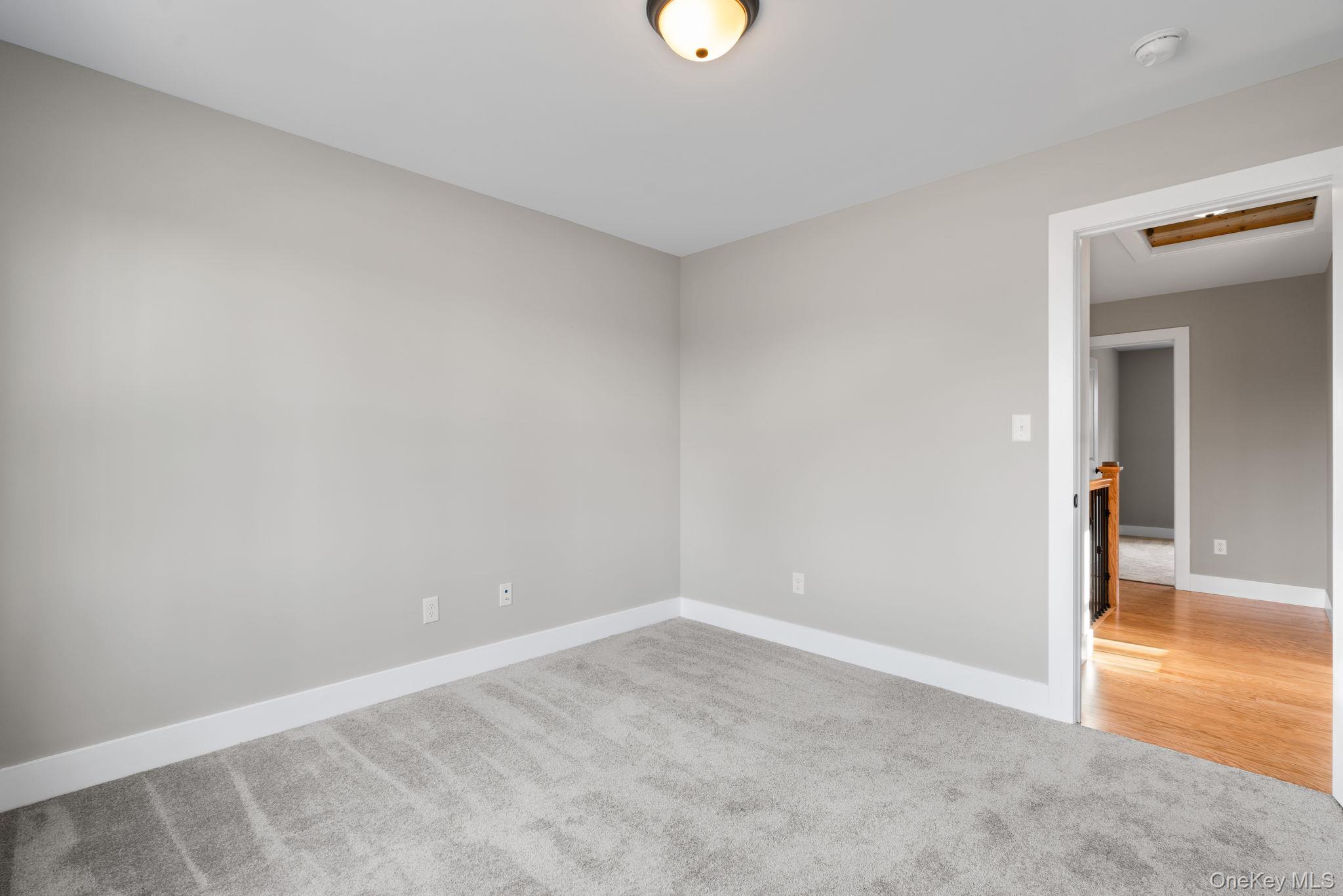 13 Harrier Ridge Drive Wallkill, NY 12589 - Photo 27 of 40 Spare room featuring light colored carpet and baseboards