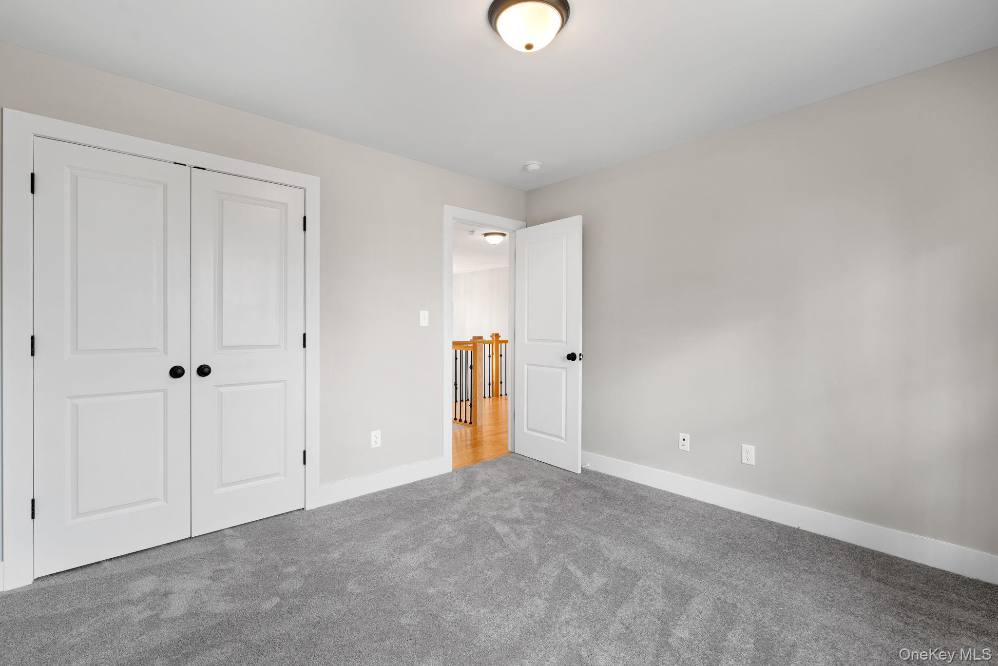 13 Harrier Ridge Drive Wallkill, NY 12589 - Photo 30 of 40 Unfurnished bedroom with carpet and a closet