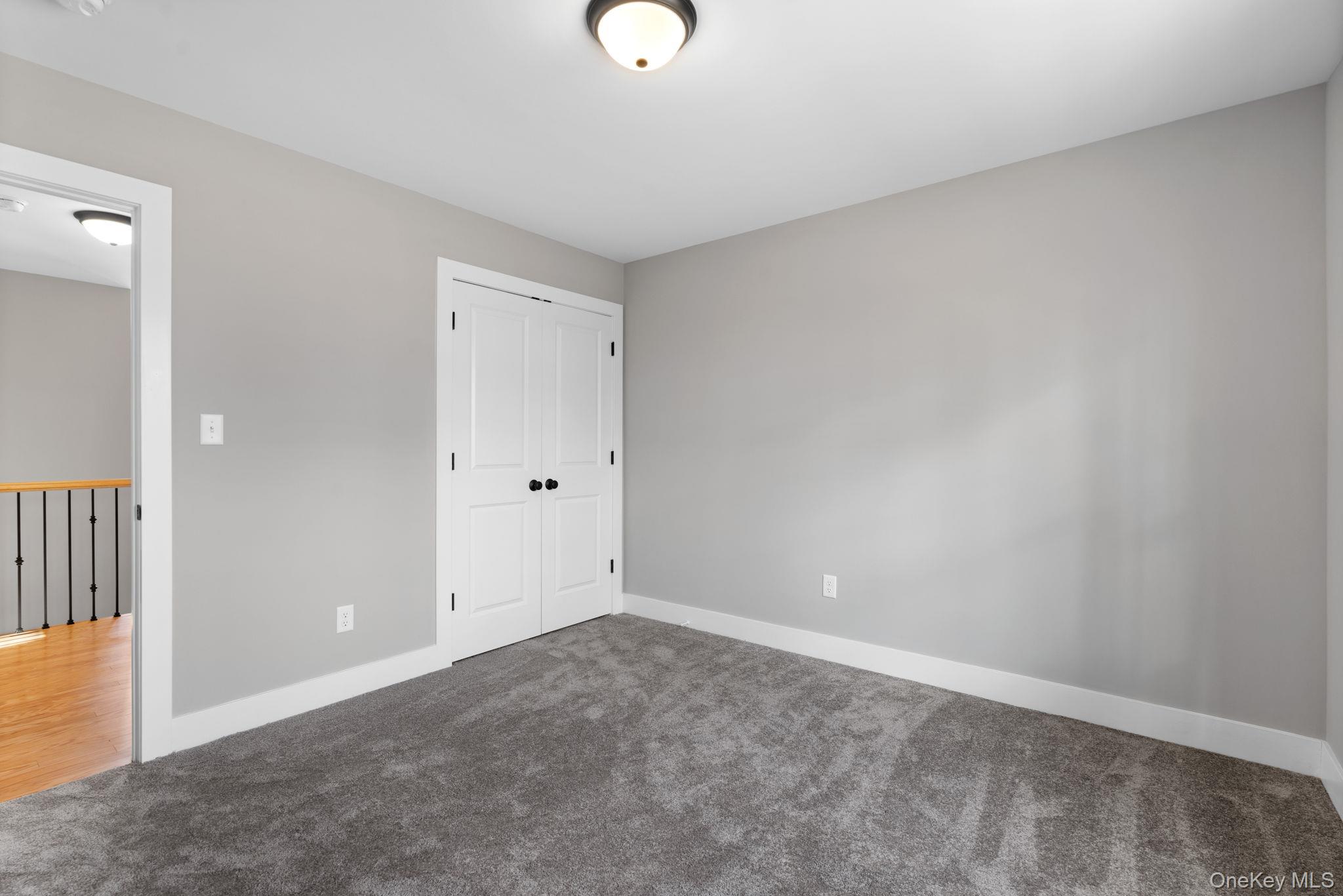 13 Harrier Ridge Drive Wallkill, NY 12589 - Photo 32 of 40 Unfurnished bedroom with carpet and a closet