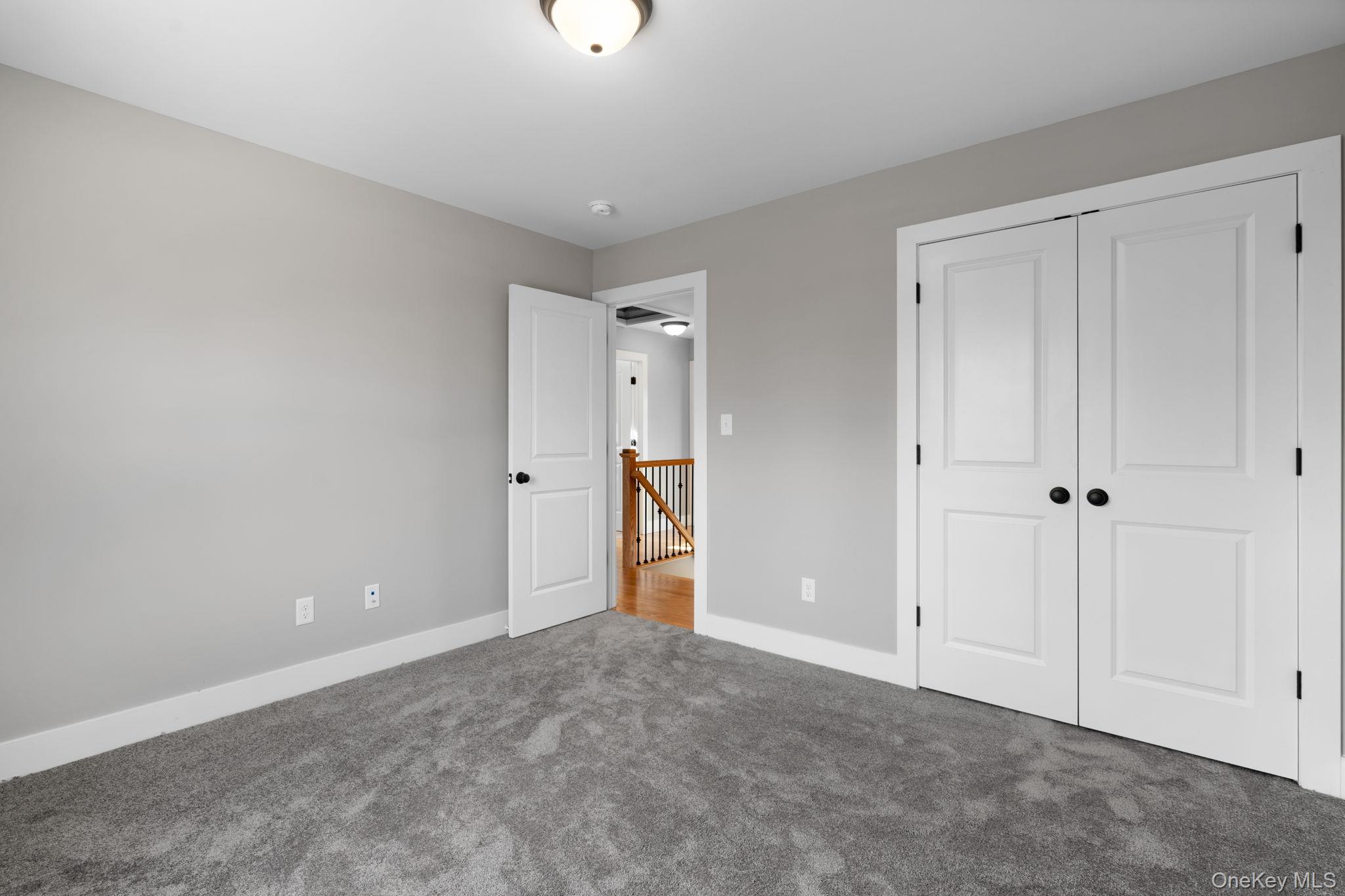 13 Harrier Ridge Drive Wallkill, NY 12589 - Photo 33 of 40 Unfurnished bedroom with carpet and a closet