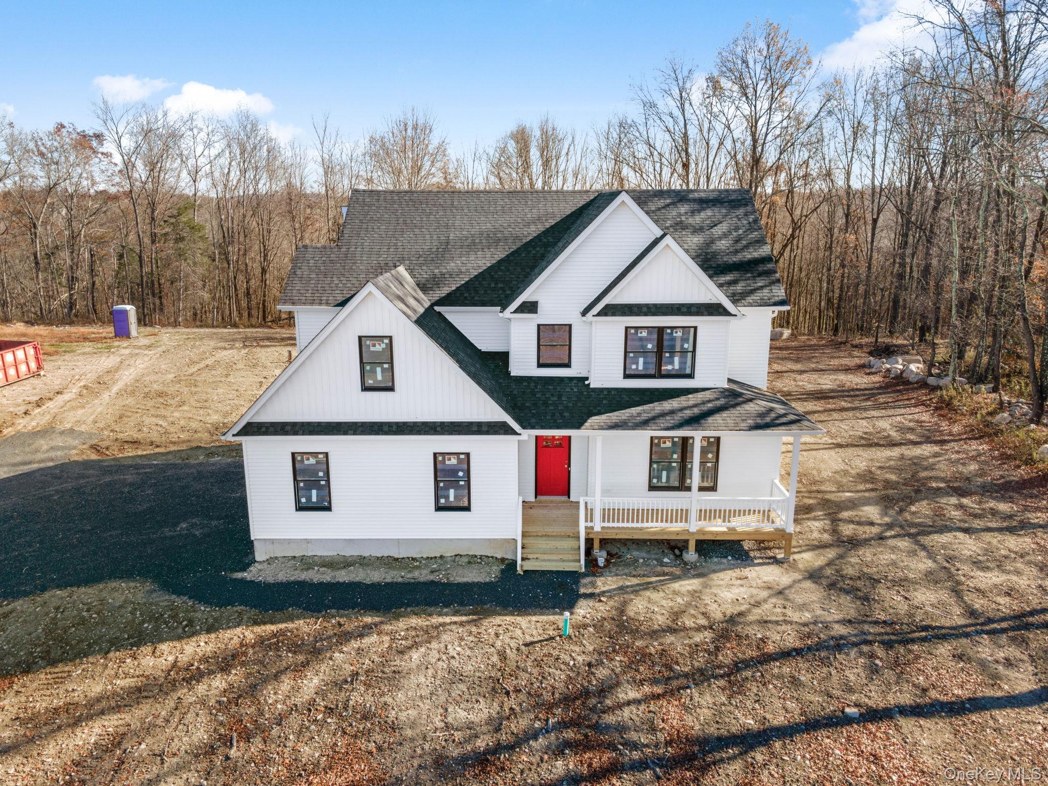13 Harrier Ridge Drive Wallkill, NY 12589 - Photo 34 of 40 View of front of property with a shingled roof and covered porch