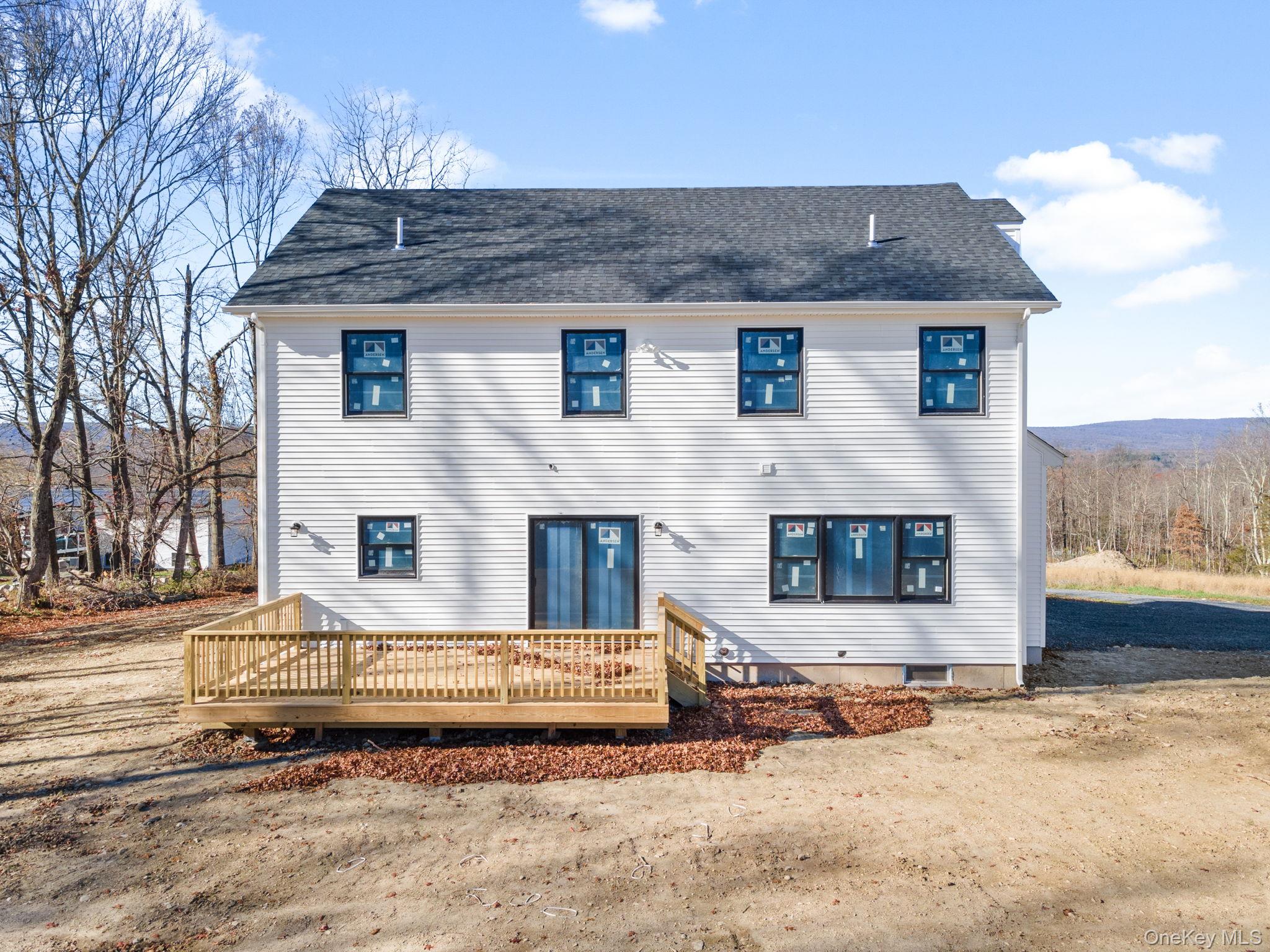 13 Harrier Ridge Drive Wallkill, NY 12589 - Photo 36 of 40 View of front of house featuring a deck and roof with shingles