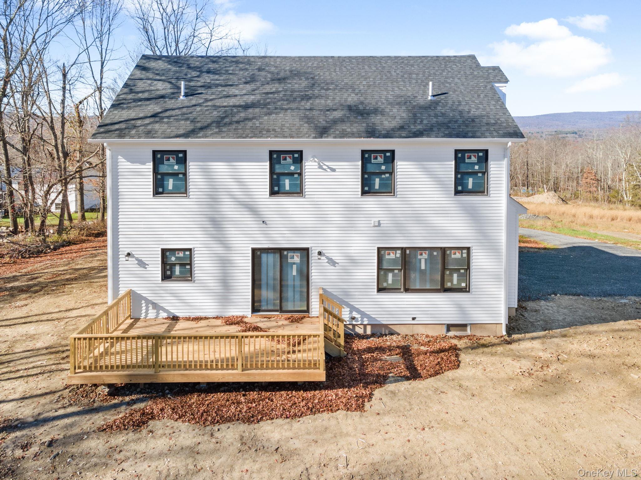 13 Harrier Ridge Drive Wallkill, NY 12589 - Photo 39 of 40 Back of house with a deck and a shingled roof