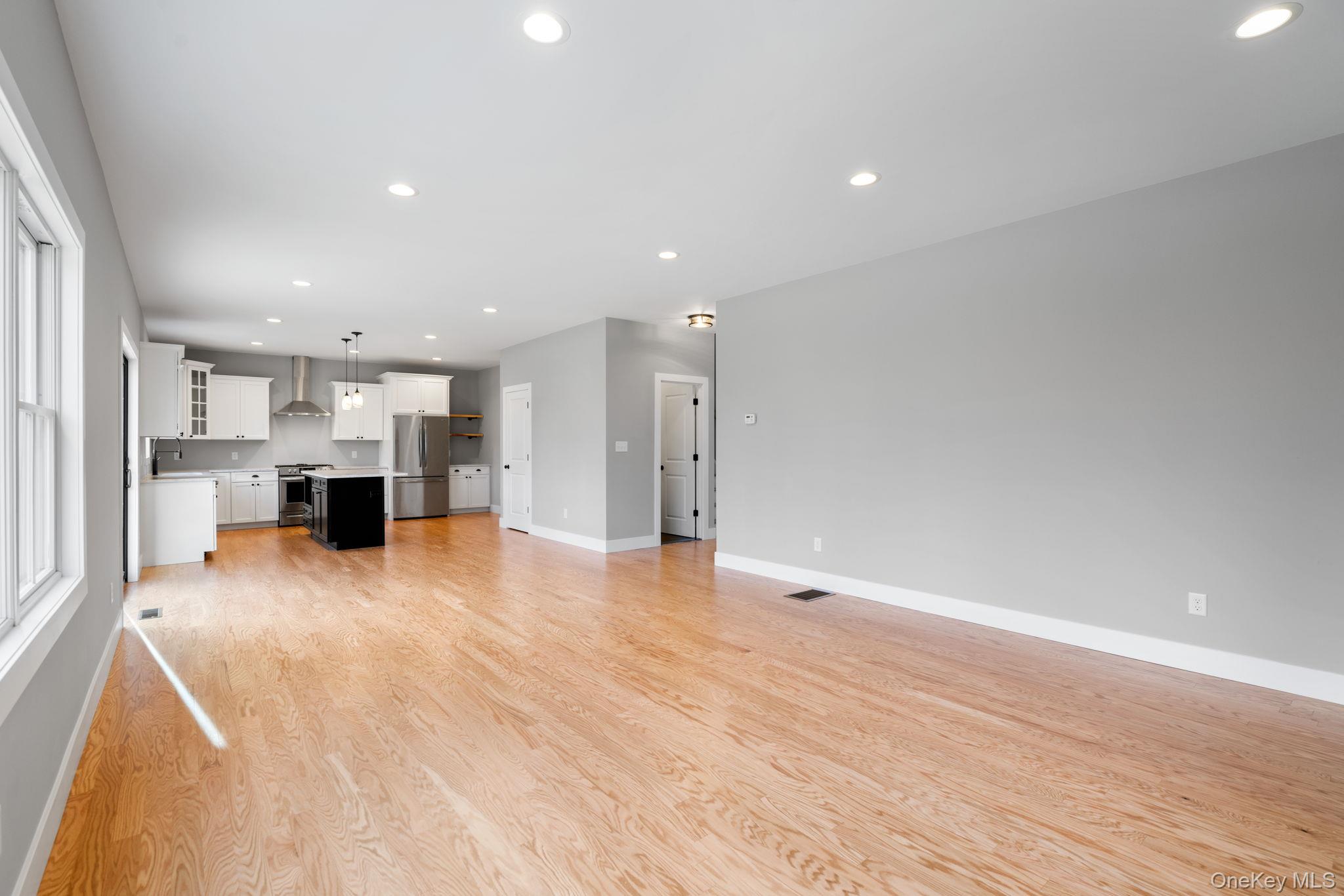 13 Harrier Ridge Drive Wallkill, NY 12589 - Photo 10 of 40 Unfurnished living room featuring recessed lighting and light wood finished floors