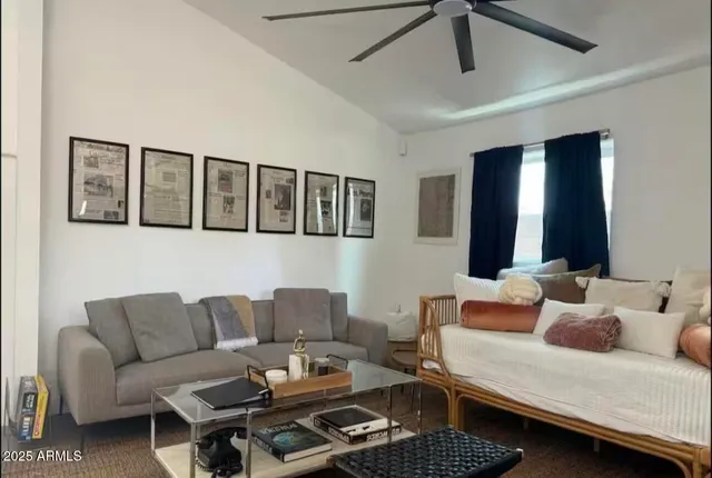 a kitchen with stainless steel appliances kitchen island granite countertop a refrigerator a stove a sink and chairs