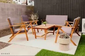 a view of swimming pool with outdoor seating