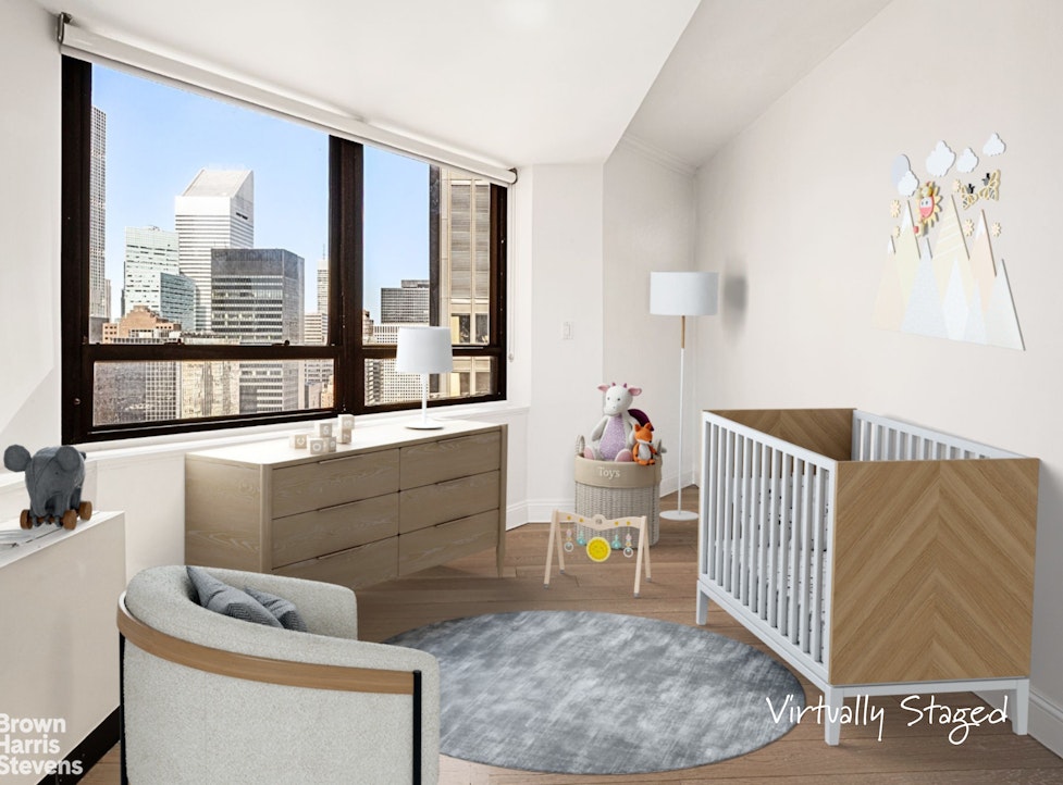 240 East 47th Street, Unit 39AB Manhattan, NY 10017 - Photo 12 of 22 a living room with furniture and a window