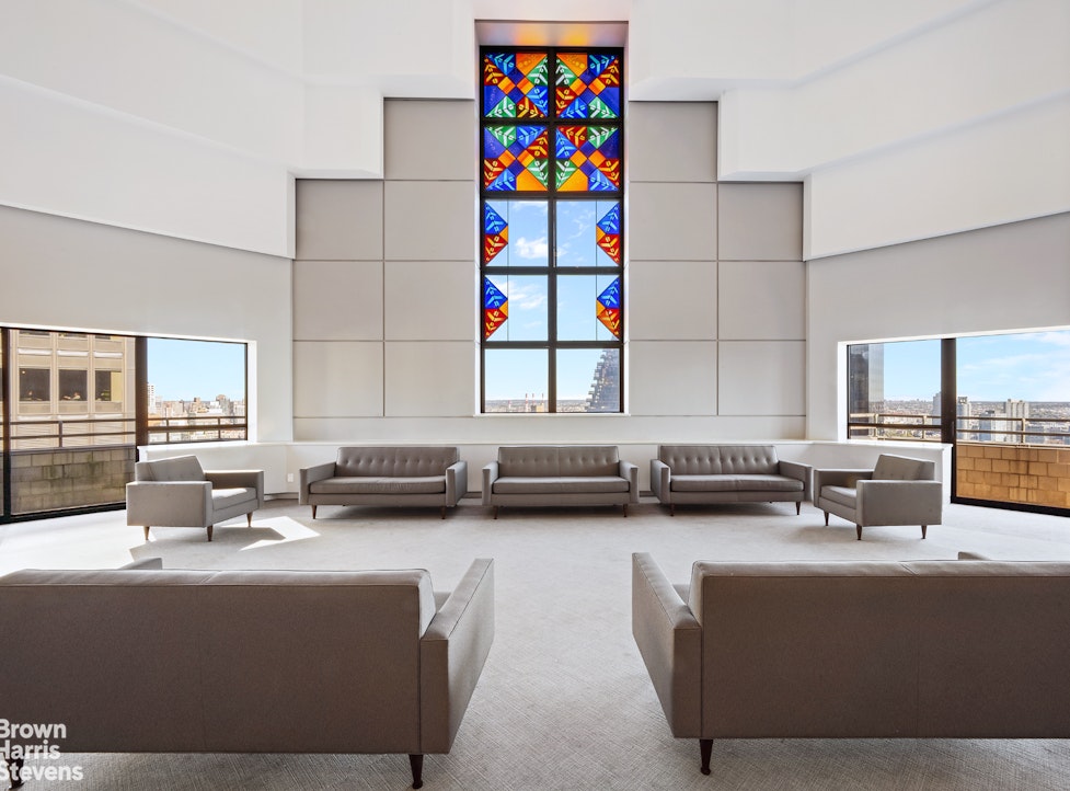 240 East 47th Street, Unit 39AB Manhattan, NY 10017 - Photo 14 of 22 a view of living room with granite countertop kitchen island stainless steel appliances a sink and a counter top space