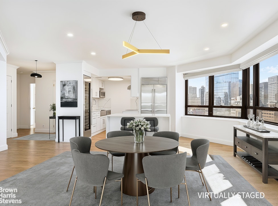 240 East 47th Street, Unit 39AB Manhattan, NY 10017 - Photo 2 of 22 a view of a dining room with furniture and wooden floor