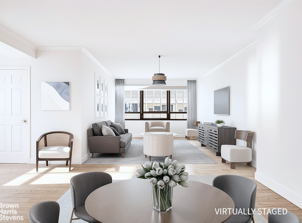 240 East 47th Street, Unit 39AB Manhattan, NY 10017 - Photo 3 of 22 a living room with furniture and a large window