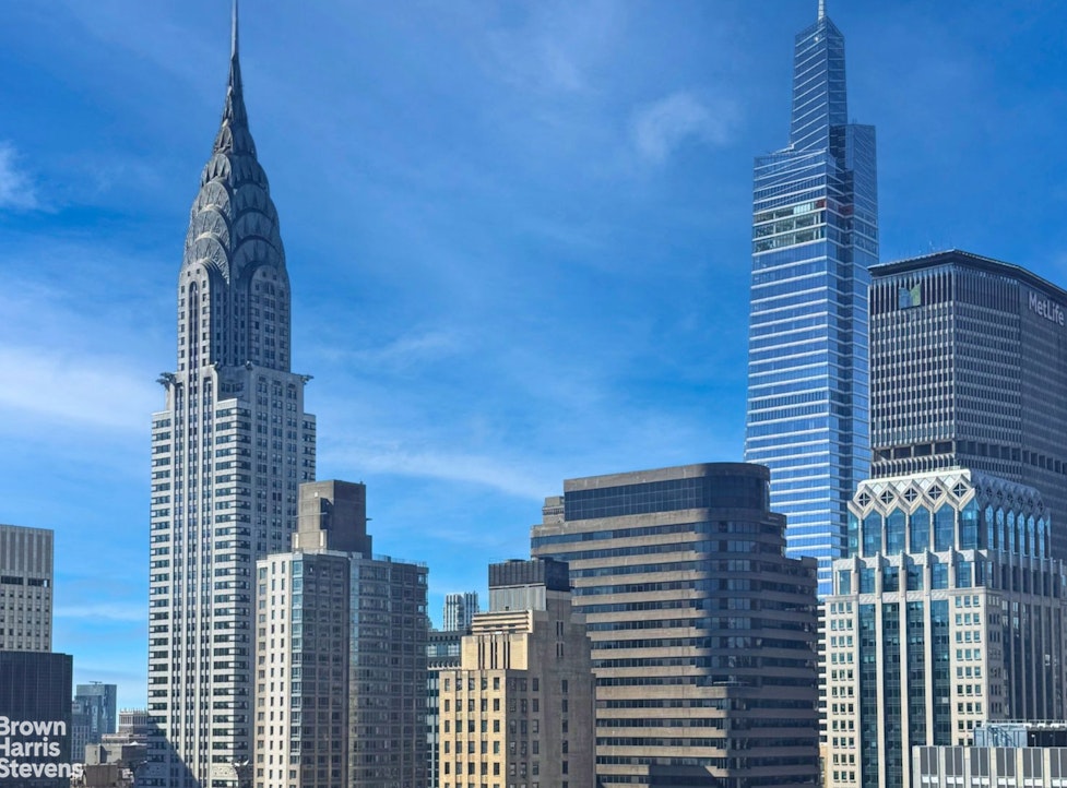 240 East 47th Street, Unit 39AB Manhattan, NY 10017 - Photo 4 of 22 a view of a city with tall buildings