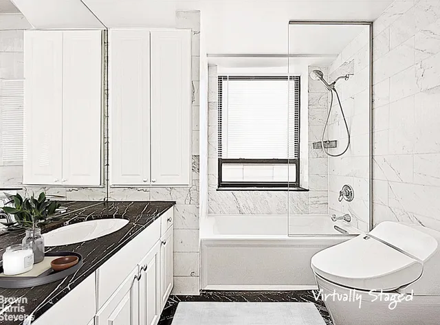 a large bedroom with a large bed and a large window