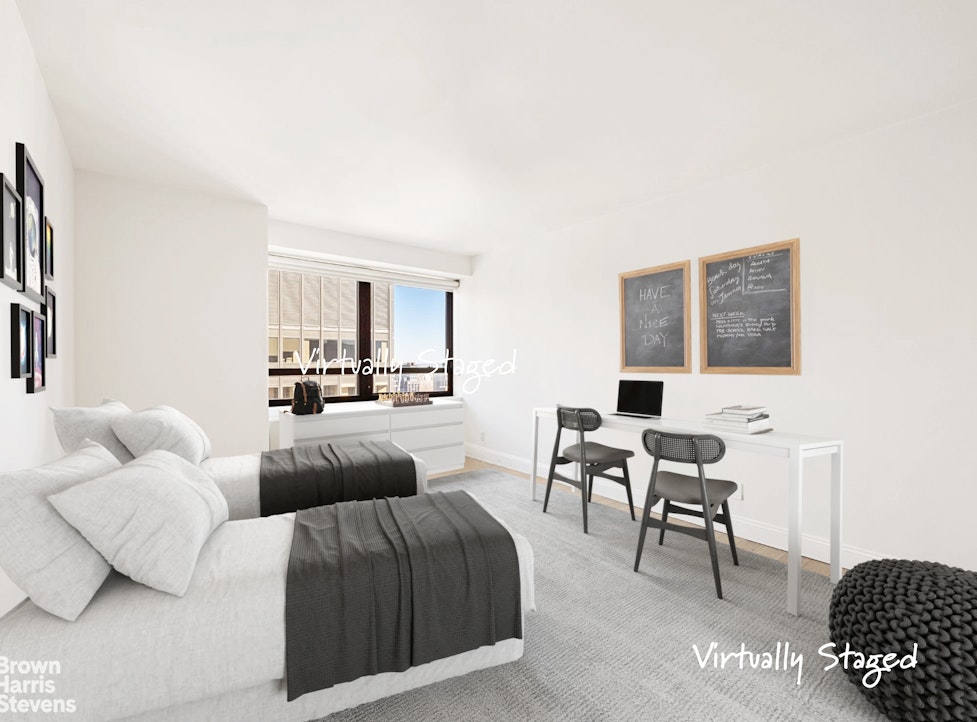 240 East 47th Street, Unit 39AB Manhattan, NY 10017 - Photo 9 of 22 a living room with furniture and a couch