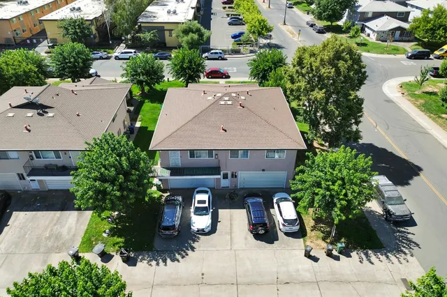 an aerial view of a house with garden space and seating space