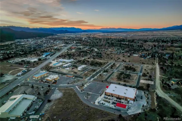 an aerial view of residential houses with city view