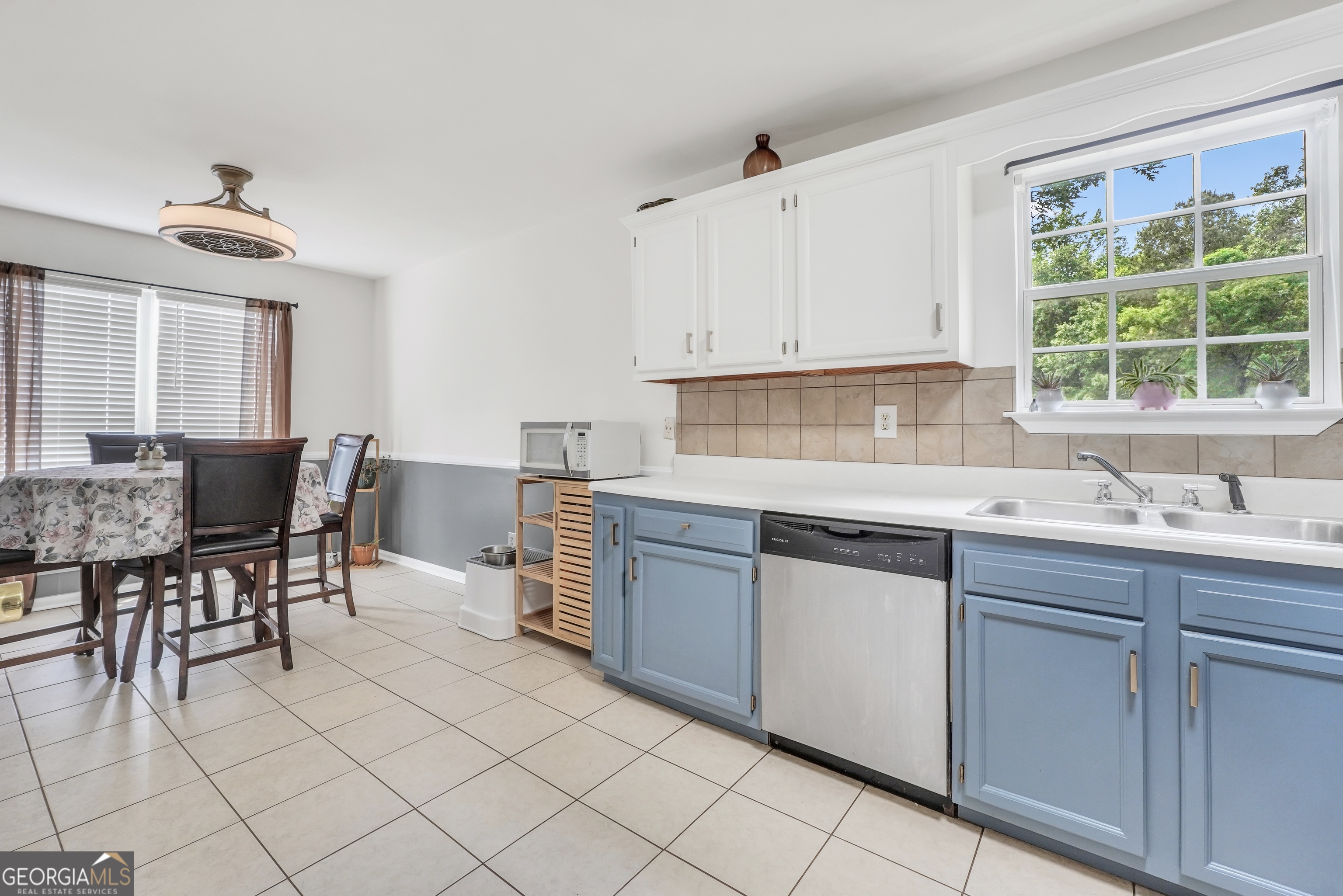110 Westeria Way Jackson, GA 30233 - Photo 11 of 45 a kitchen with kitchen island granite countertop cabinets table and chairs