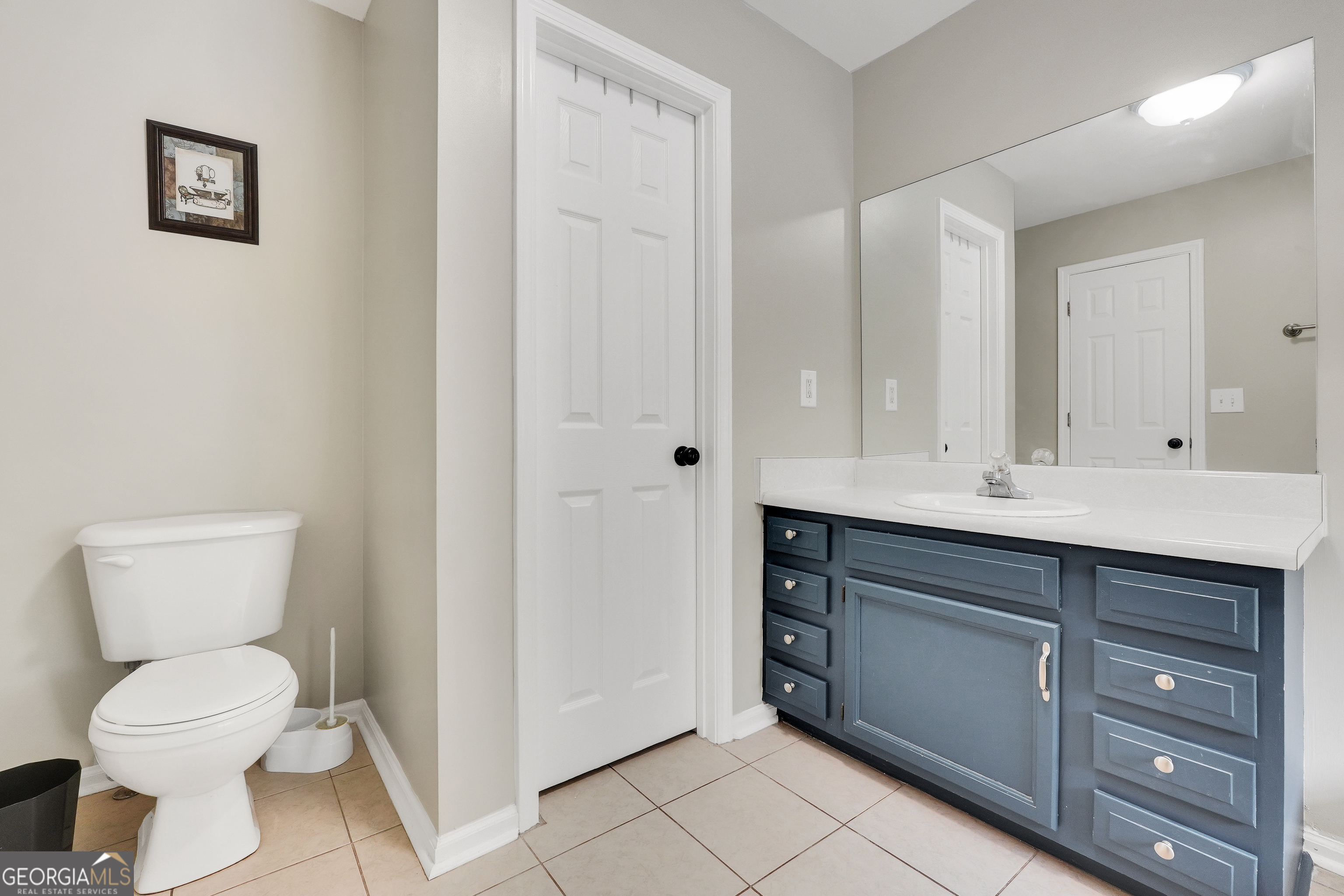 110 Westeria Way Jackson, GA 30233 - Photo 17 of 45 a bathroom with a toilet sink and mirror
