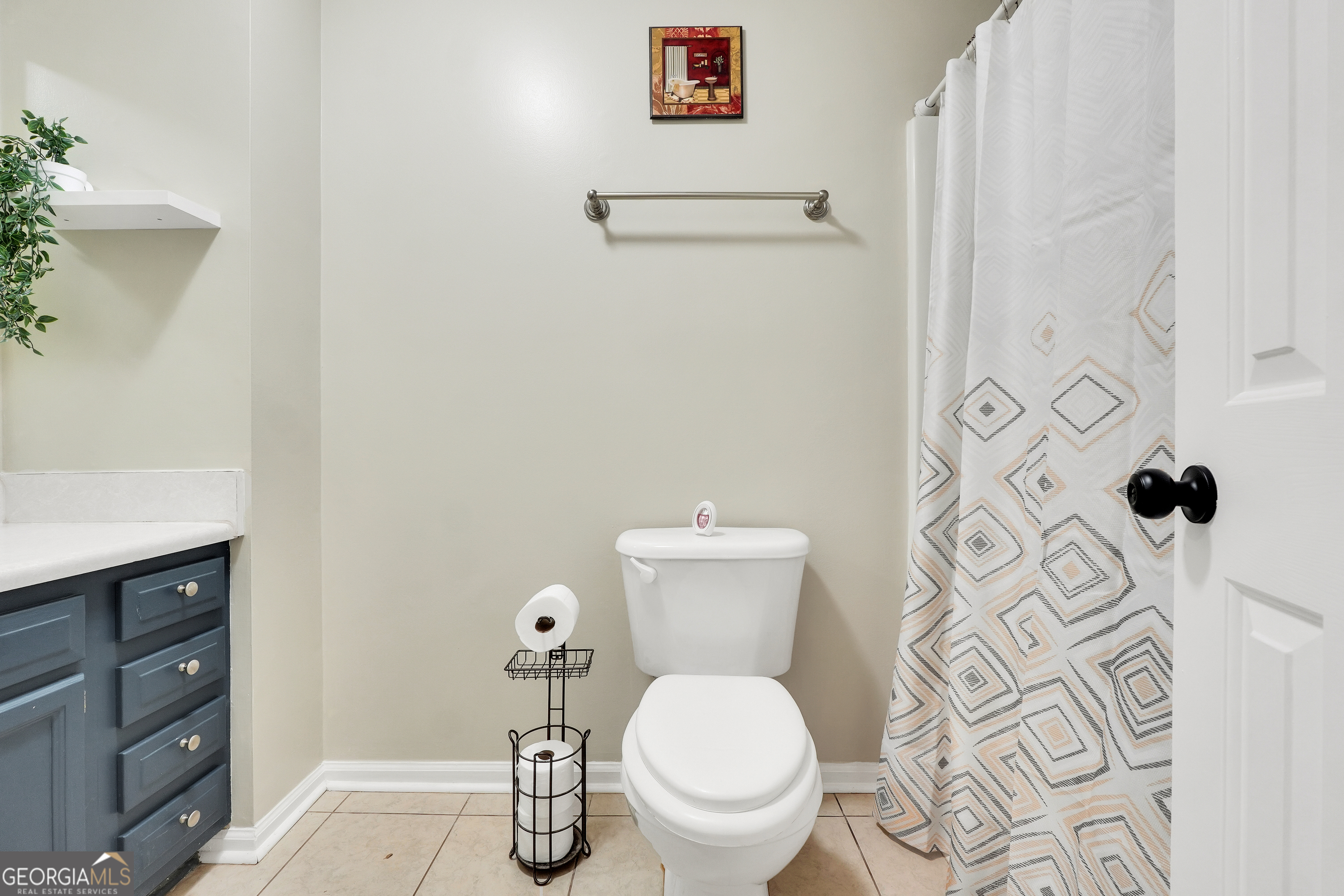 110 Westeria Way Jackson, GA 30233 - Photo 26 of 45 a bathroom with a toilet and a shower