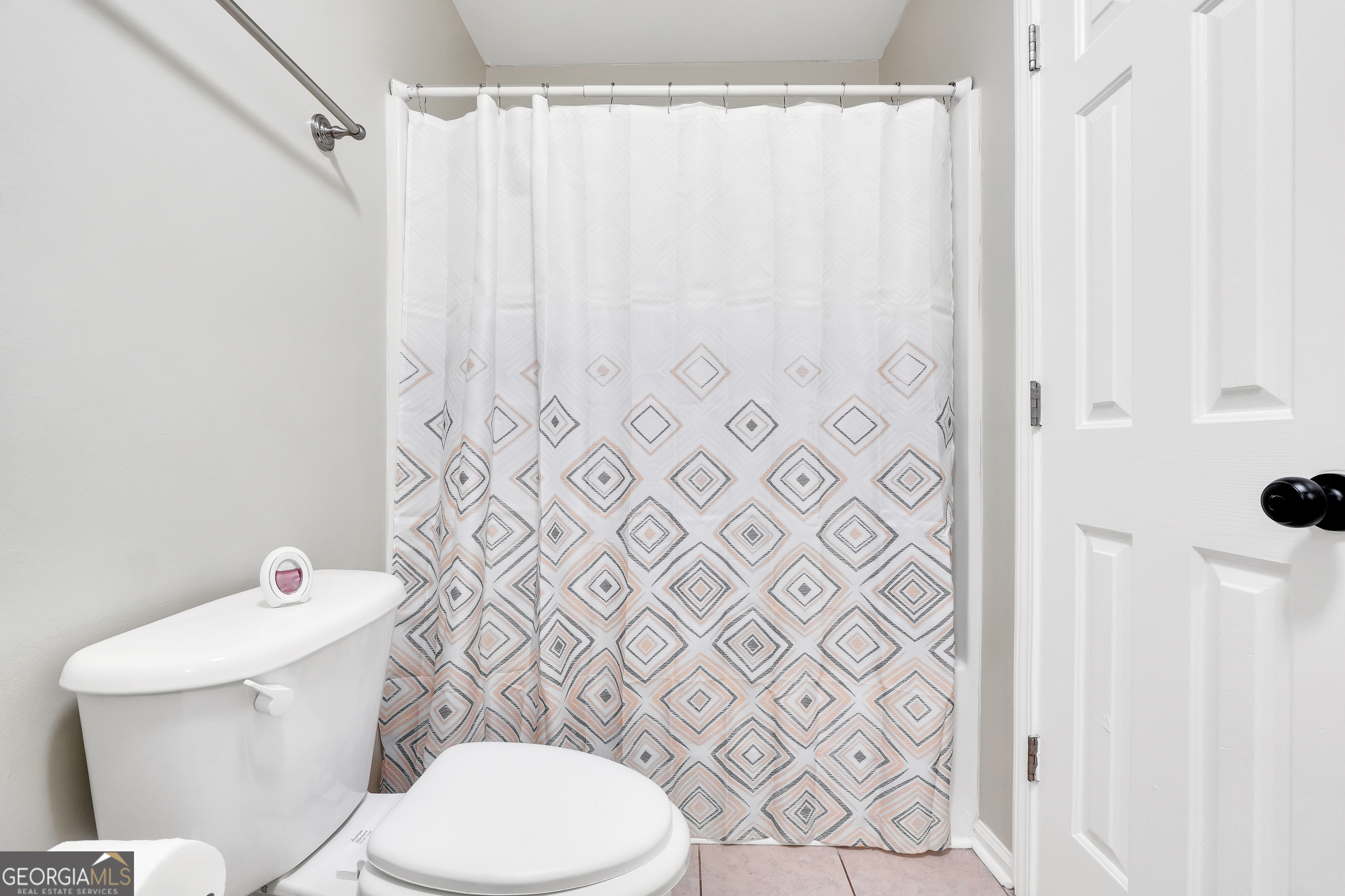 110 Westeria Way Jackson, GA 30233 - Photo 27 of 45 a white toilet sitting next to a white curtain