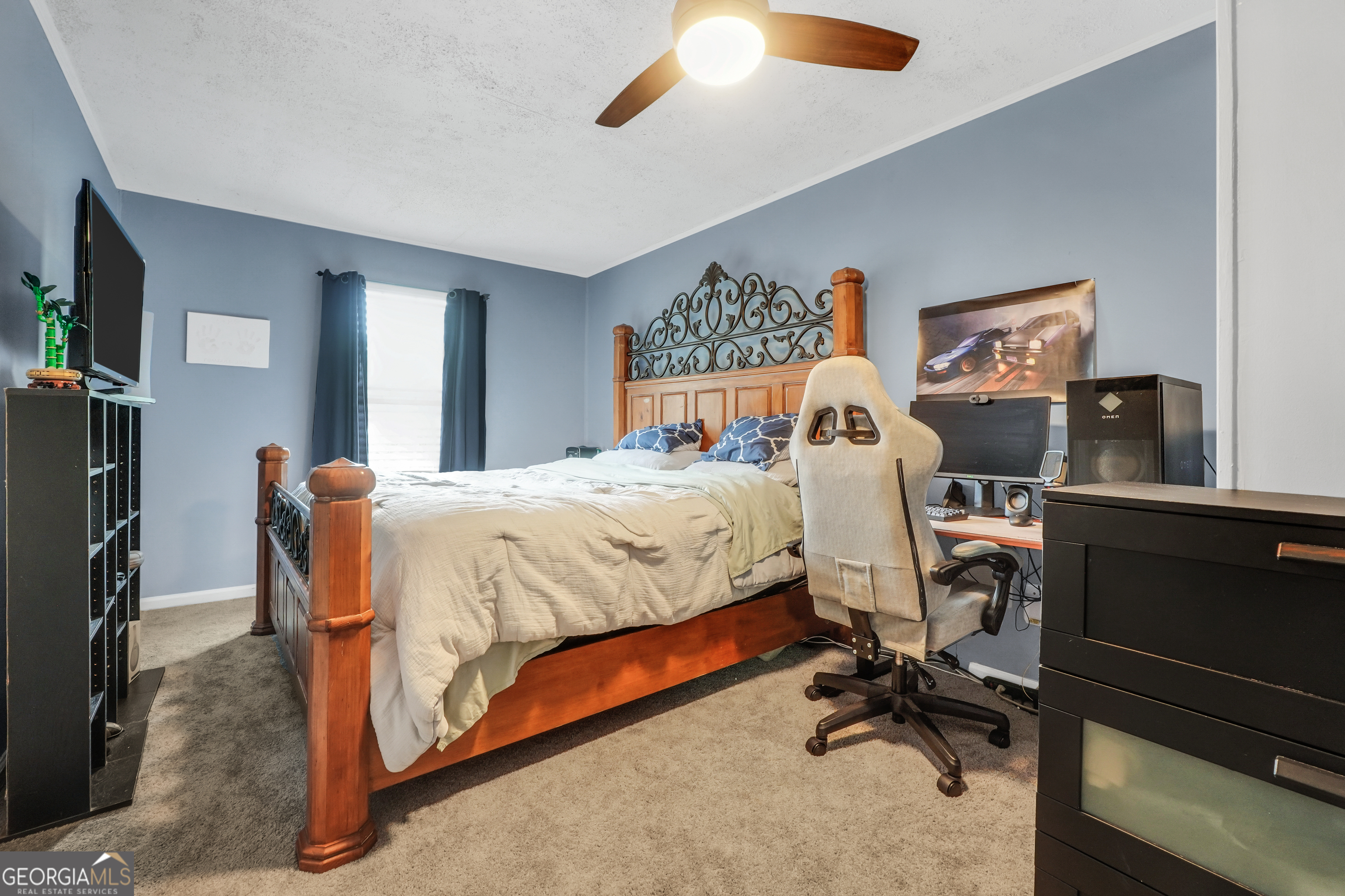 110 Westeria Way Jackson, GA 30233 - Photo 28 of 45 a bedroom with a bed and a desk