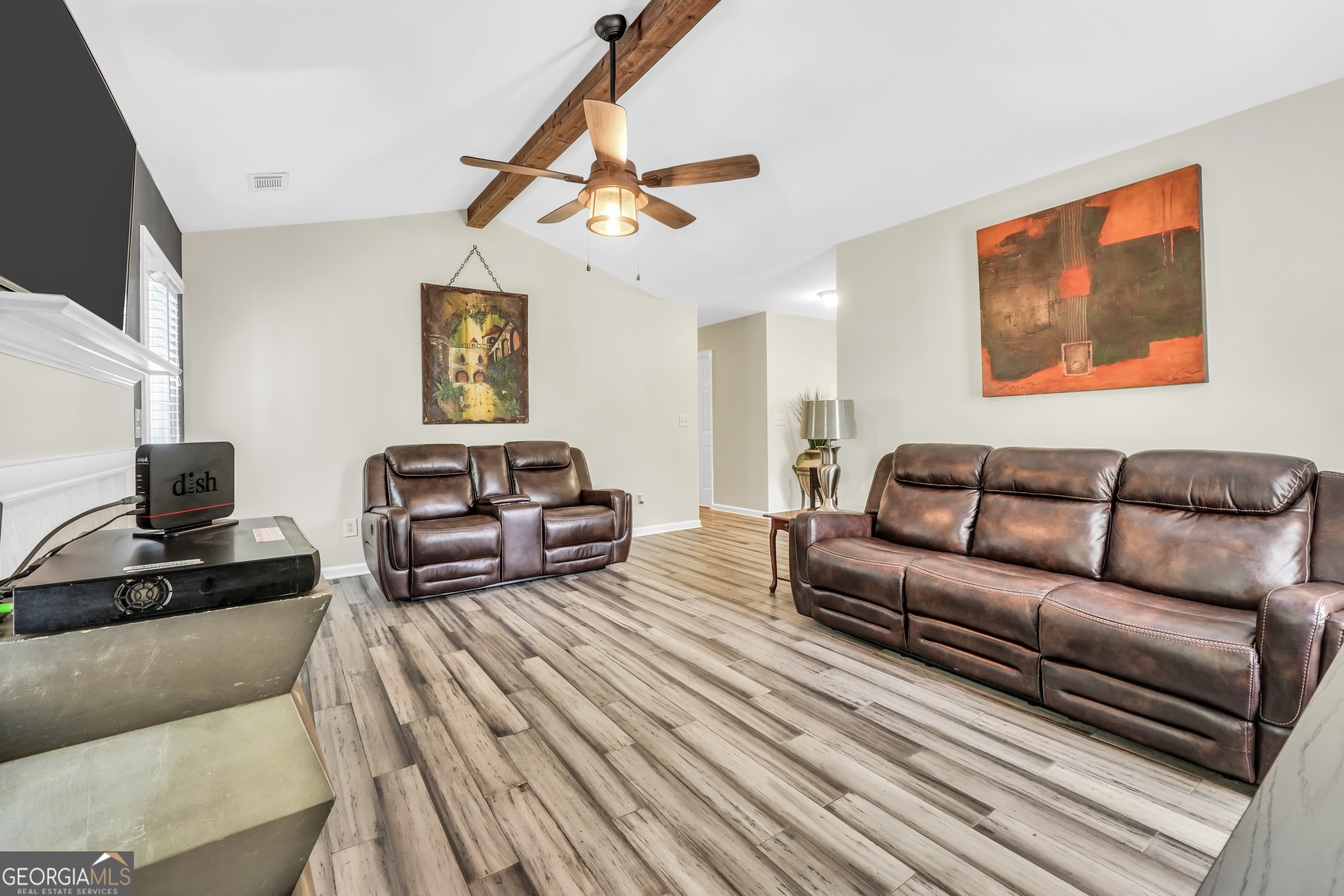 110 Westeria Way Jackson, GA 30233 - Photo 9 of 45 a spacious bedroom with a bed couch and a window